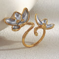 two-tone stainless steel open ring with sculpted silver-finish flower petals