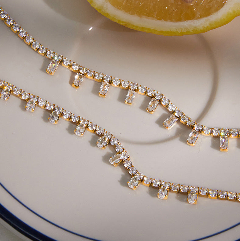 Close-up of two clear stone fringe patterns