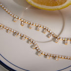 Close-up of two clear stone fringe patterns