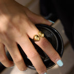 Gold tone open ring with rounded ends close-up