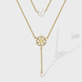 gold plated layered snowflake necklace with white shell pearl beads