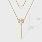 gold plated layered snowflake necklace with white shell pearl beads
