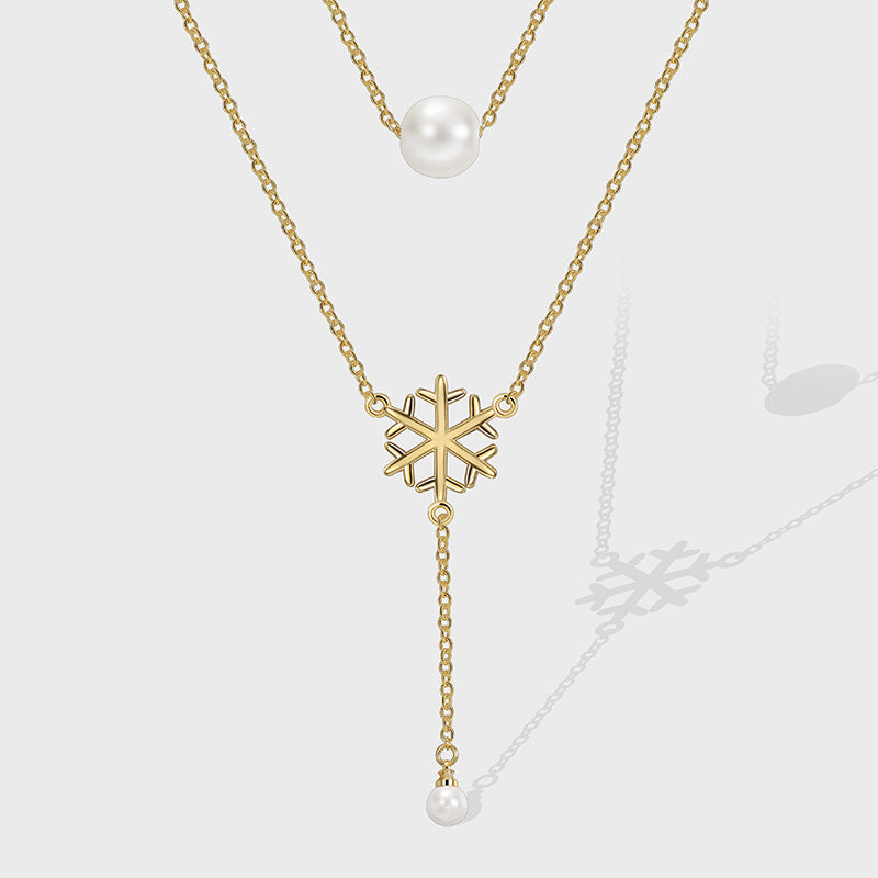 gold plated layered snowflake necklace with white shell pearl beads