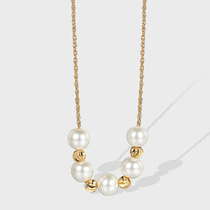 gold plated necklace with seven round white shell pearls