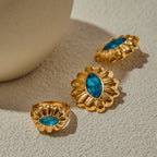 Gold-Tone Blue Zircon Floral Stainless Steel Ring – flat-lay view