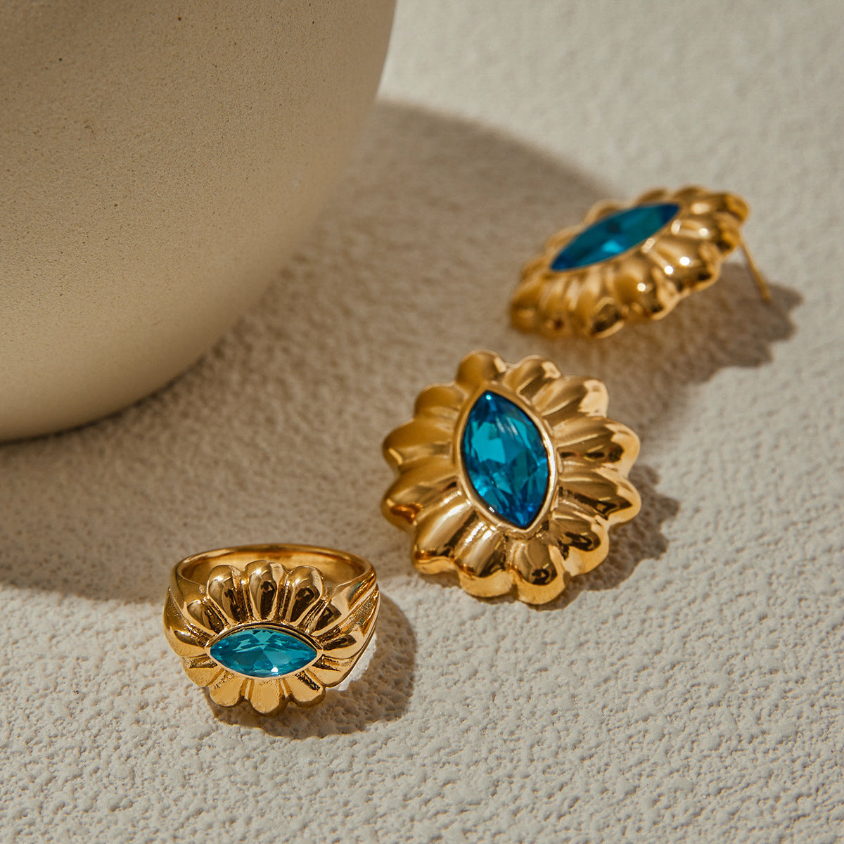 Gold-Tone Blue Zircon Floral Stainless Steel Ring – flat-lay view