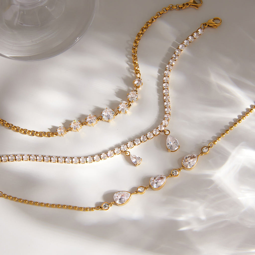 Three stainless steel bracelet designs laid out