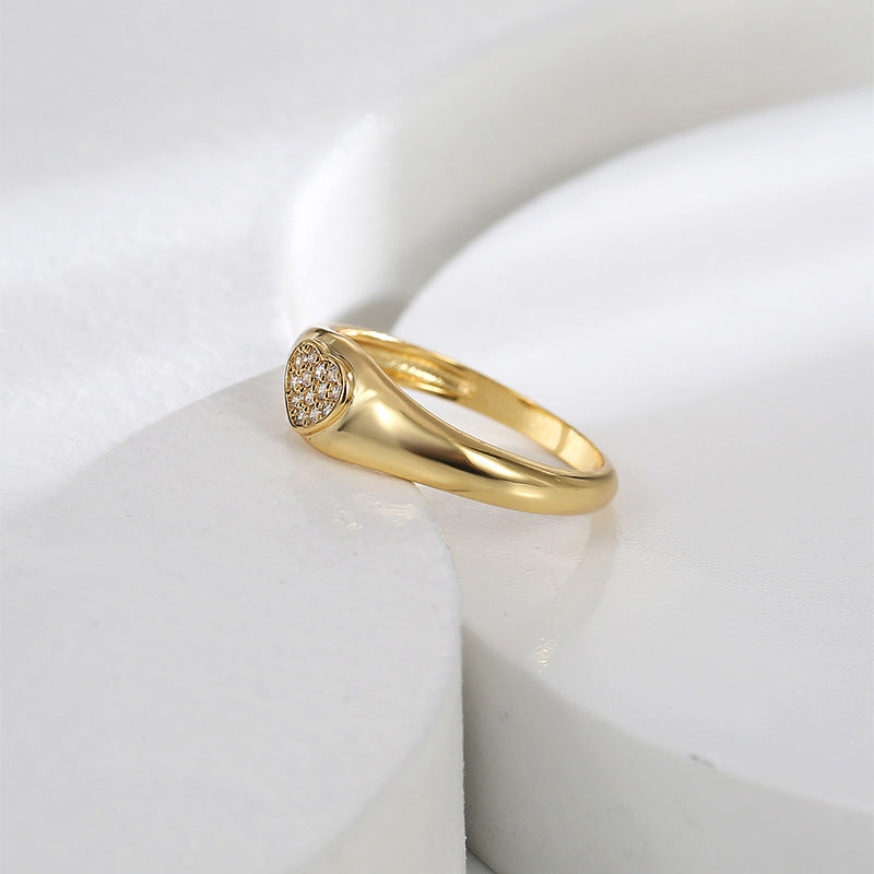 side angle of low-profile gold plated heart signet ring