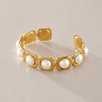 Open back and square bead frames on the gold-tone cuff