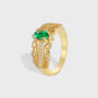gold plated brass cocktail ring with oval green center stone