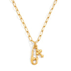 isolated safety pin pendant necklace with round clear accent