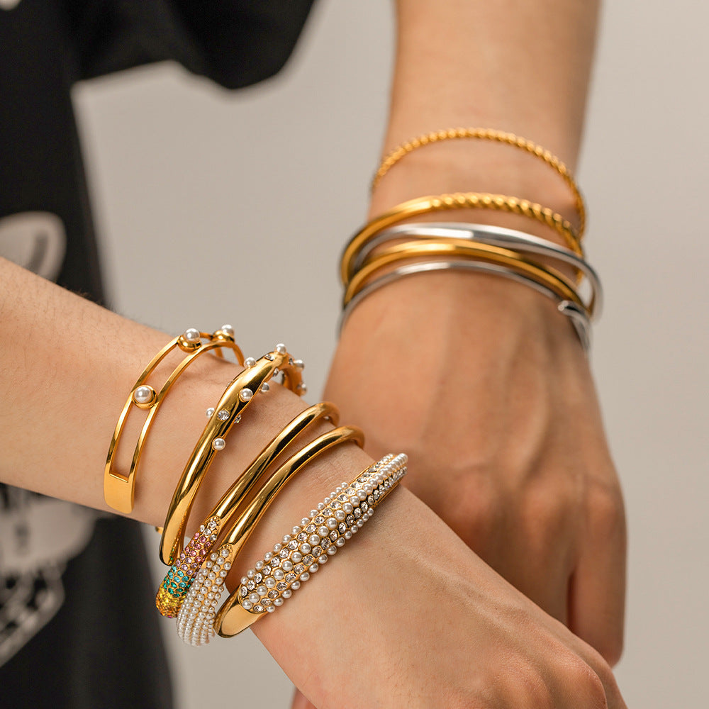 Gold plated cuff bracelet stack styled on wrist