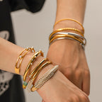 Gold plated cuff bracelet stack styled on wrist