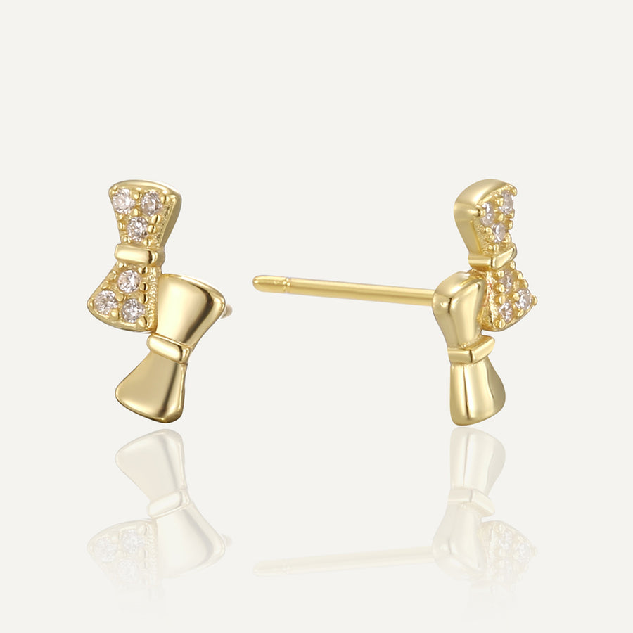 gold plated asymmetric clear stone bow stud earrings front and side view