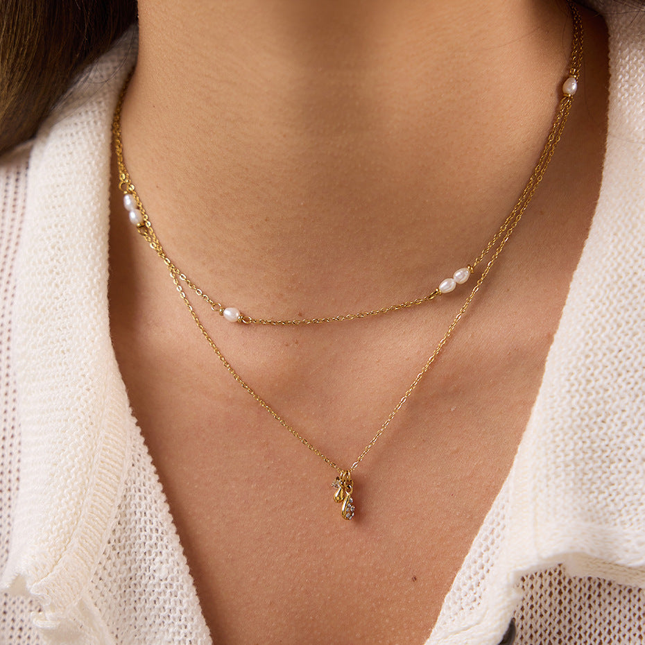 Spaced white beads shown at the neckline