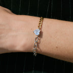 Heart-center chain bracelet worn close-up