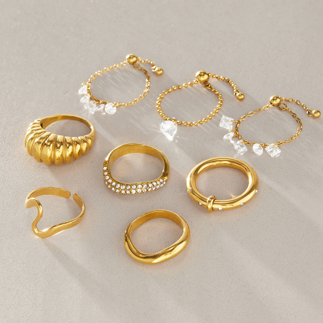 Clear drop chain rings with several gold tone bands