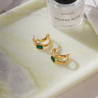 Open backs and stud posts of the double hoop earrings
