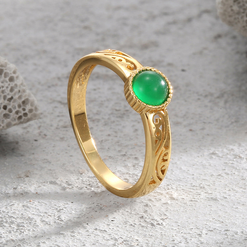 upright view of the green agate ring and scrollwork shoulders