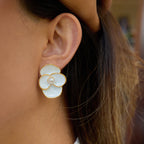 Gold-Tone White Floral Stainless Steel Stud Earrings – close-up view
