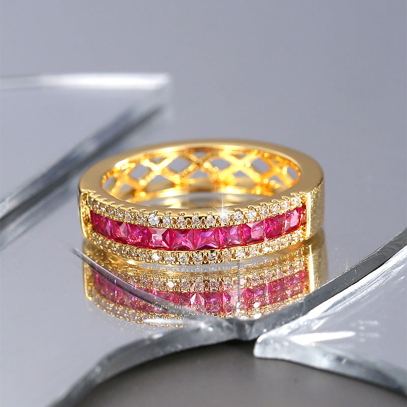 front view of red center stones between clear pavé-style rows
