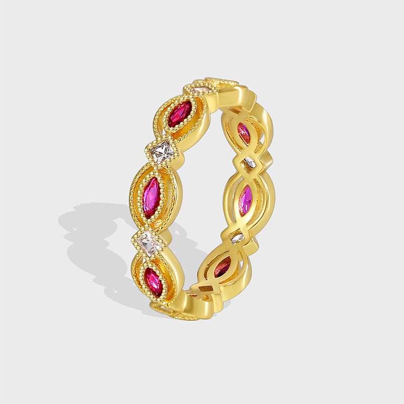 isolated gold plated red marquise stone openwork band ring