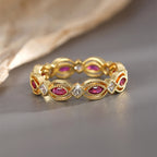 front view of repeating red marquise and clear stone links