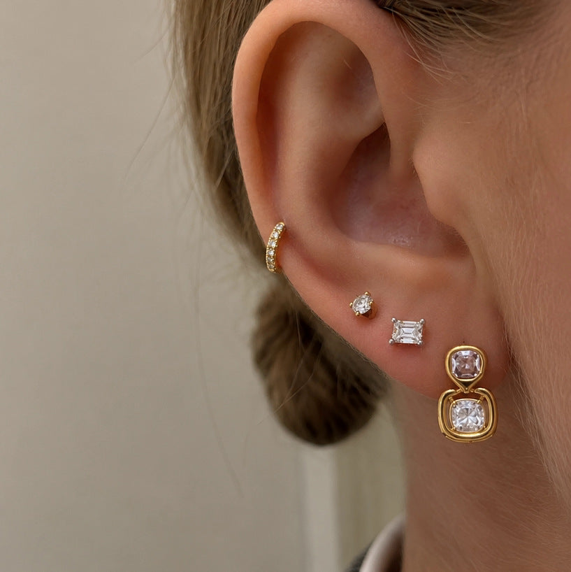 Double cushion earring shown in an ear jewelry stack