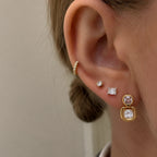 Double cushion earring shown in an ear jewelry stack