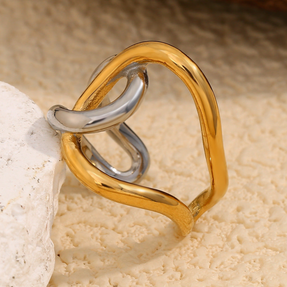 front angle of the gold plated and silver-finish sculptural ring