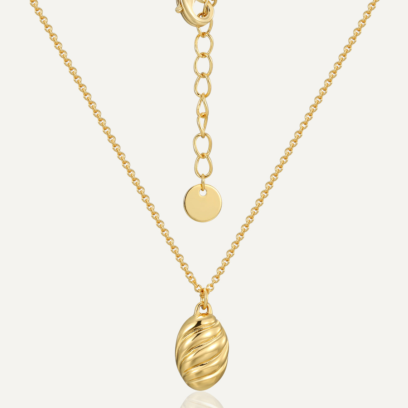 gold plated brass ribbed oval pendant necklace with extension chain