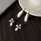Two white accent earring styles on a plate