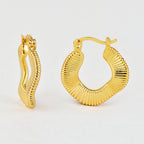 textured brass hoop earrings viewed from front and side