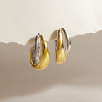 Two-tone sculptural open hoops front view