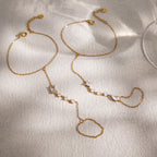 Two hand chain designs displayed on fabric