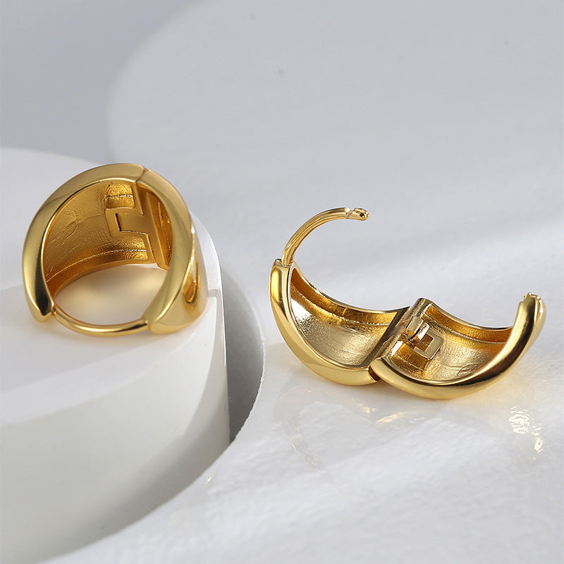 gold plated shield hoop earrings shown open and closed