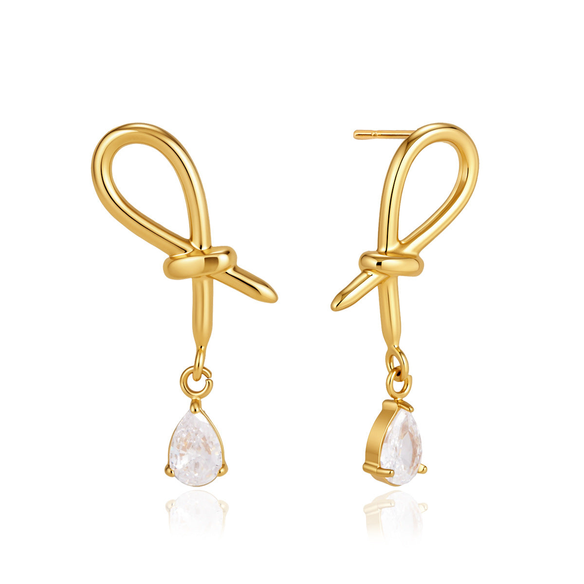 Knotted gold tone loop earrings on white