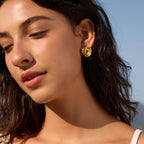 Rounded knot earrings styled on a model