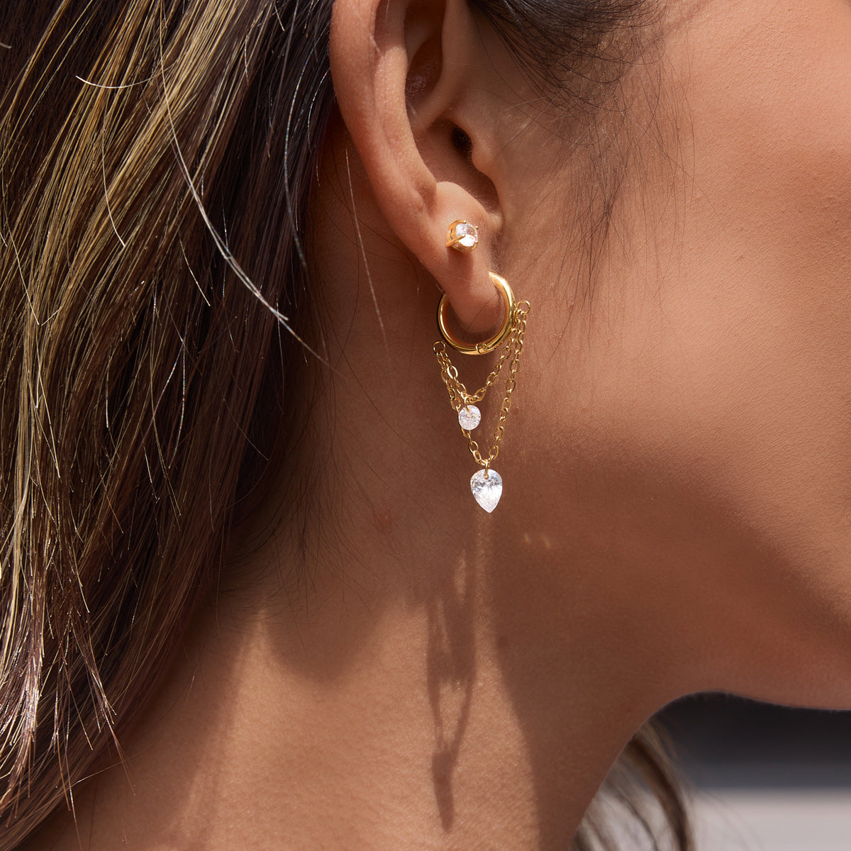 Longer layered chain hoop worn on an ear