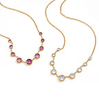 Fine chain necklaces with graduated round bezels
