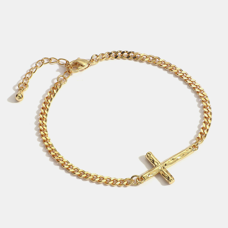 gold plated brass cross curb chain bracelet on white