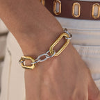 Two-tone oversized link bracelet worn on a wrist