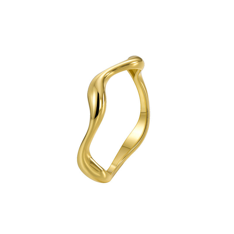 isolated stone-free gold plated sculptural wave ring