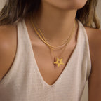 Layered star necklace shown from a wider angle