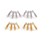 Gold and steel stud pairs on white