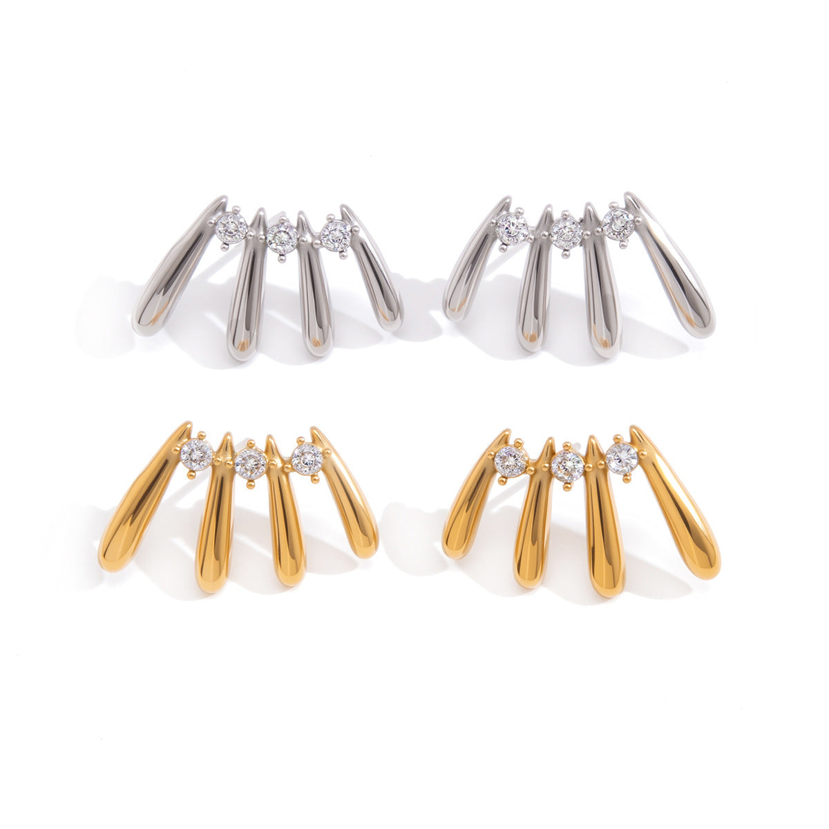 Gold and steel stud pairs on white