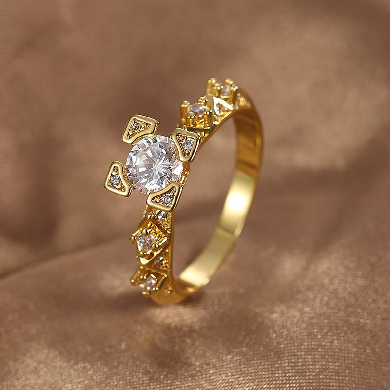 angled view of round center stone and zirconia-set shoulders
