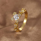 angled view of round center stone and zirconia-set shoulders