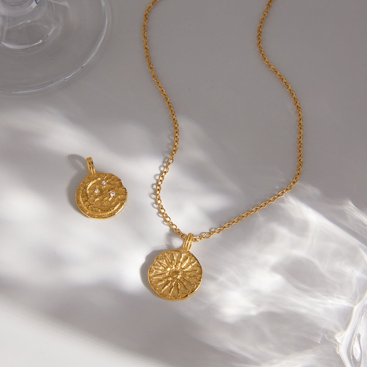 Medallion necklace with reverse face visible