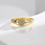 front angle of zirconia heart ring on a white display surface